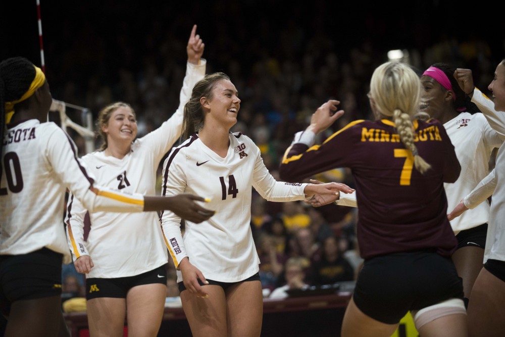 Setter Kylie Miller celebrates a scored point with her team at the Maturi Pavilion on Saturday, Sept. 7. The Gophers defeated Florida 3 sets to 0 for their home opener. 