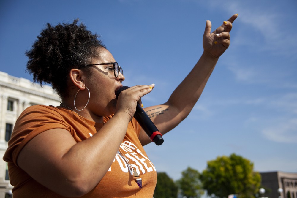 Director of Black Visions Collective Kandace Montgomery delivers a prepared speech to those gathered at the Minnesota State Capitol Building on Friday, Sept. 20, 2019. One of several speakers at the Global Climate Strike, Montgomery advocated for improved environmental legislation and acknowledged the risks climate change poses to marginalized communities. 