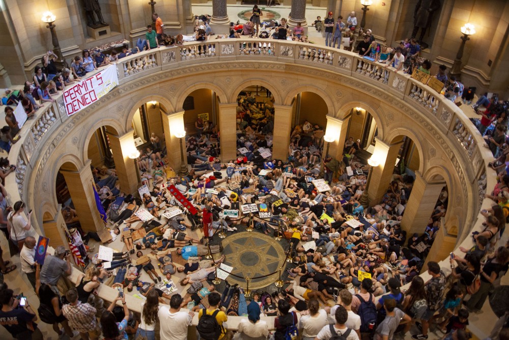 Demonstrators attending the Global Climate Strike pack the rotunda at the Minnesota State Capitol Building on Friday, Sept. 20, 2019. In protest of the current state of environmental legislation and the proposed climate crisis, participants staged a die in. 