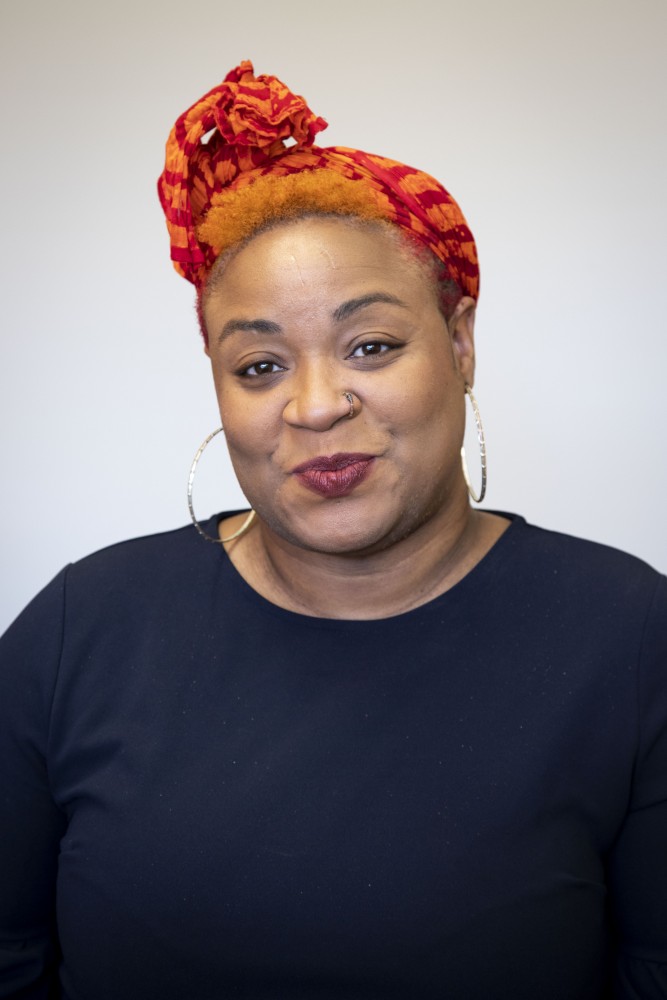 Fayola Jacobs, an assistant Professor at the Humphrey School of Public Affairs, poses for a portrait on Tuesday, Sept. 24, 2019. Jacobs says, “I’m excited to be at the U teaching and learning with students who are passionate about working with communities to understand and solve complex social justice issues.”  

