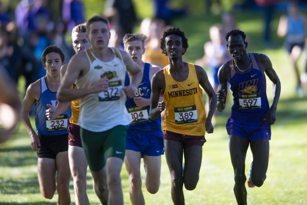 Redshirt Freshman Khalid Hussein passes an opponent at the 2019 Roy Griak Invitational at the Les Bolstad Golf Course on Saturday, Sept. 28, 2019. The Gophers mens team placed 7th in the Division 1 race. 
