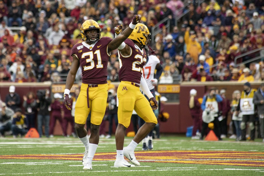 Defensive backs Kiondre Thomas and Jordan Howden hold up their fists at TCF Bank Stadium on Saturday, Oct. 5, 2019. The Gophers defeated Illinois 40 to 17 to bring their record to 5-0.