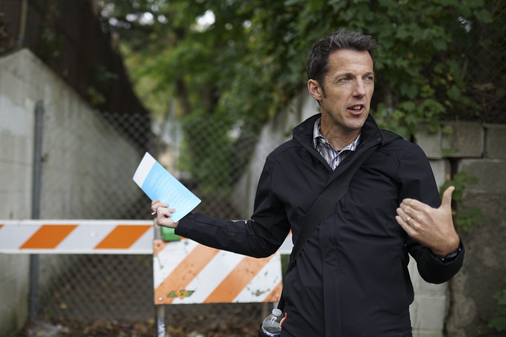 Chair of the Prospect Park Association’s transportation and safety committee Evan Roberts speaks at a pedestrian safety workshop in the Prospect Park neighborhood on Friday, Oct. 4. (Parker Johnson / Minnesota Daily)