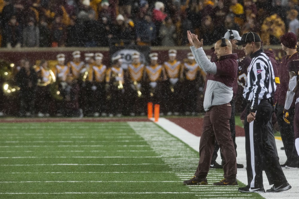 Head Coach P.J. Fleck signals to the Gophers at TCF Bank Stadium on Saturday, Oct. 12. 