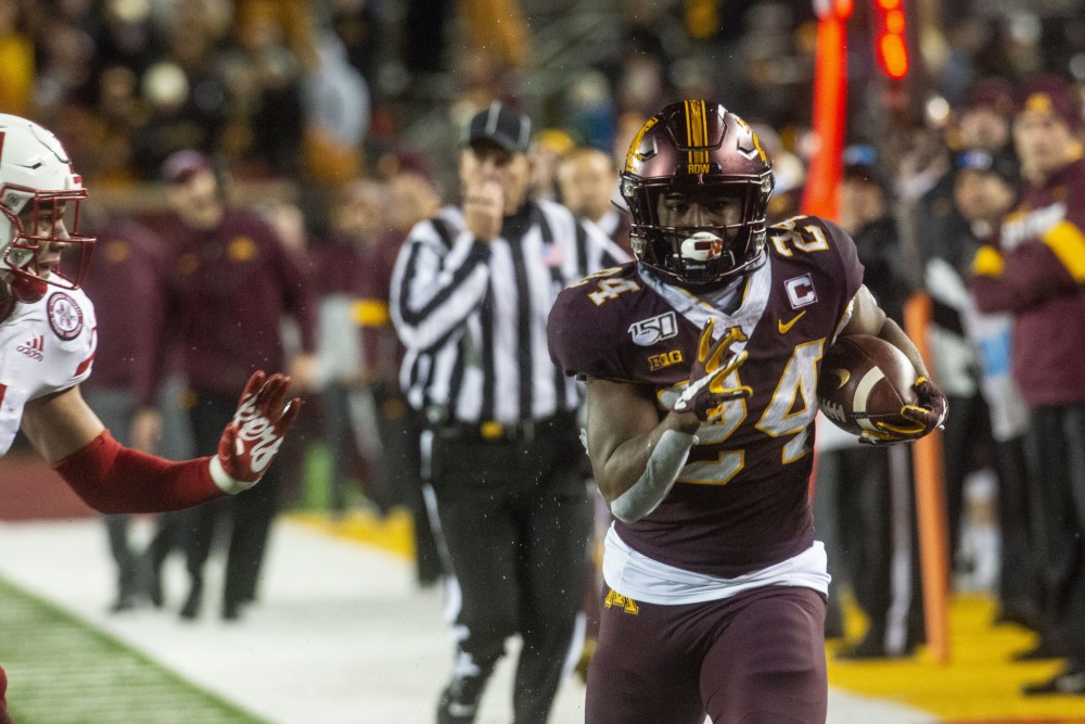 Running back Mohamed Ibrahim carries the ball for a big gain late in the fourth quarter at TCF Bank Stadium on Saturday, Oct. 12. 