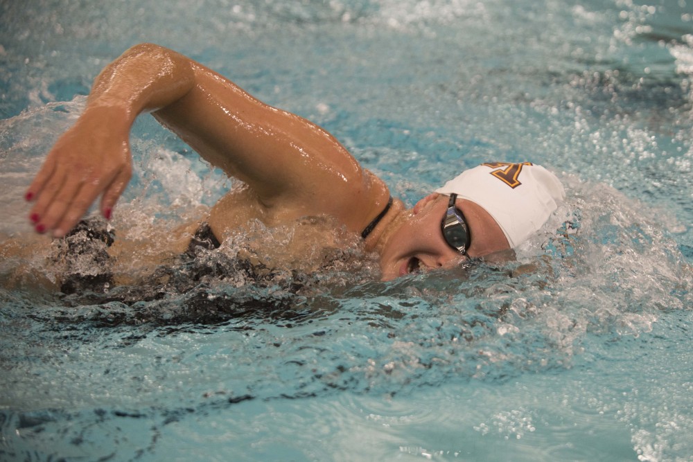 Junior Brittany Horn competes against the University of Florida at the Jean K. Freeman Aquatic Center on Friday, Oct. 11.