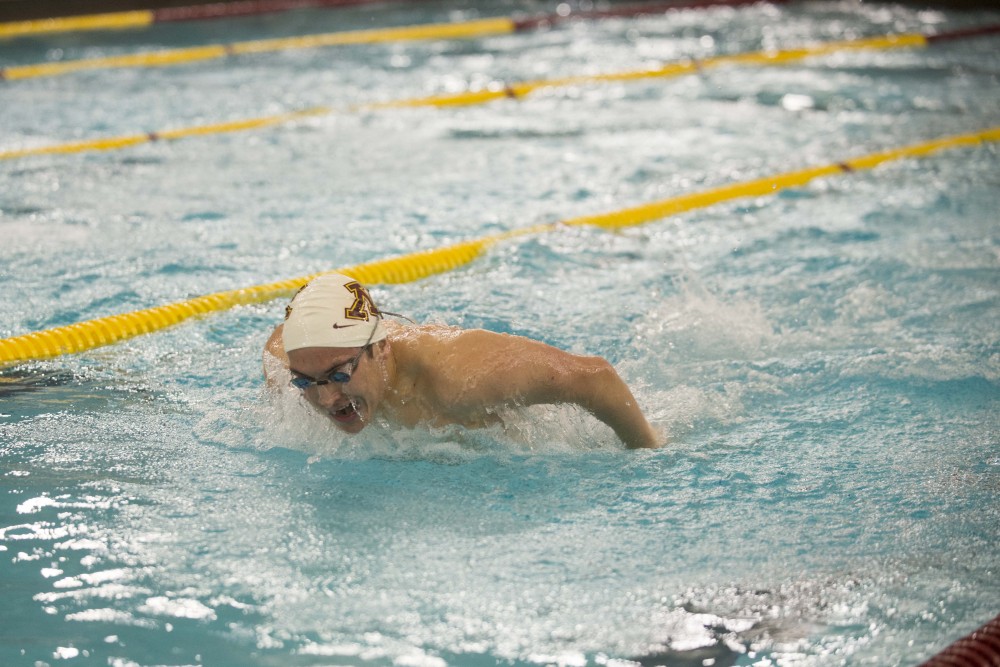 Junior Matthew Thomas competes against the University of Florida at the Jean K. Freeman Aquatic Center on Friday, Oct. 11.