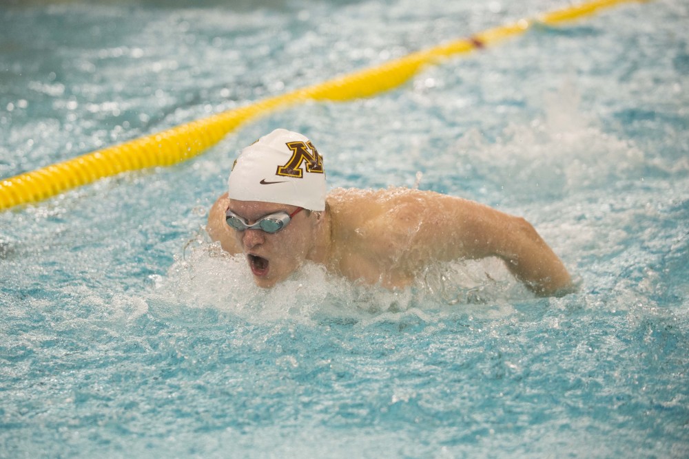 Sophomore Max Lezer competes against the University of Florida at the Jean K. Freeman Aquatic Center on Friday, Oct. 11.