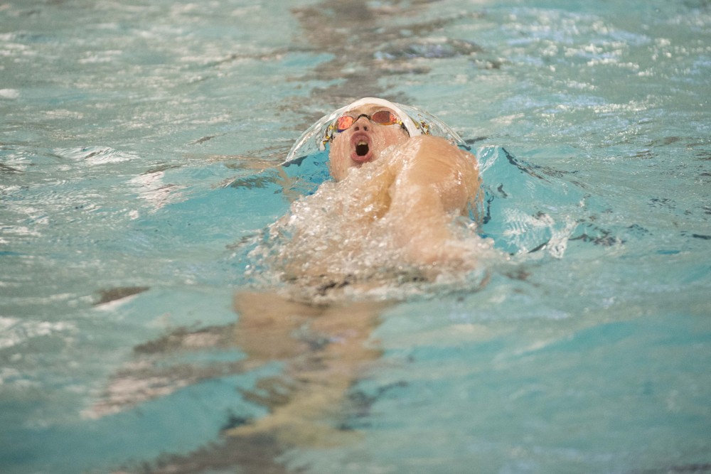 Sophomore Cale Berkoff competes against the University of Florida at the Jean K. Freeman Aquatic Center on Friday, Oct. 11.