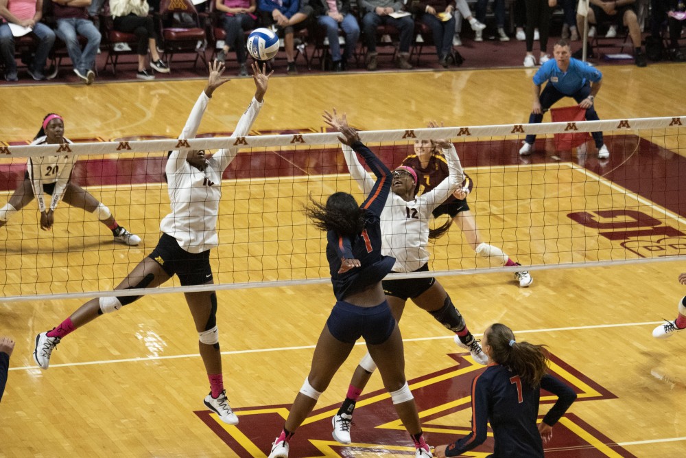 Opposite Hitter Stephanie Samedy jumps to block the ball at the Maturi Pavilion on Saturday, Oct. 19. The Gophers defeated Illinois three sets to one. 