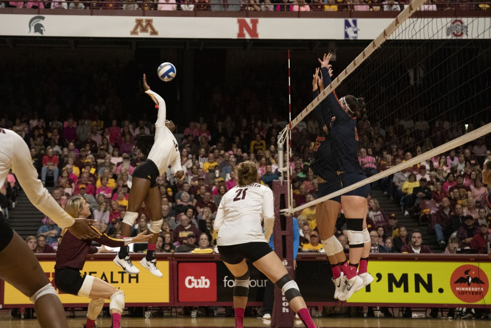 Outside Hitter Adanna Rollins jumps to spike the ball at the Maturi Pavilion on Saturday, Oct. 19. The Gophers defeated Illinois three sets to one. 