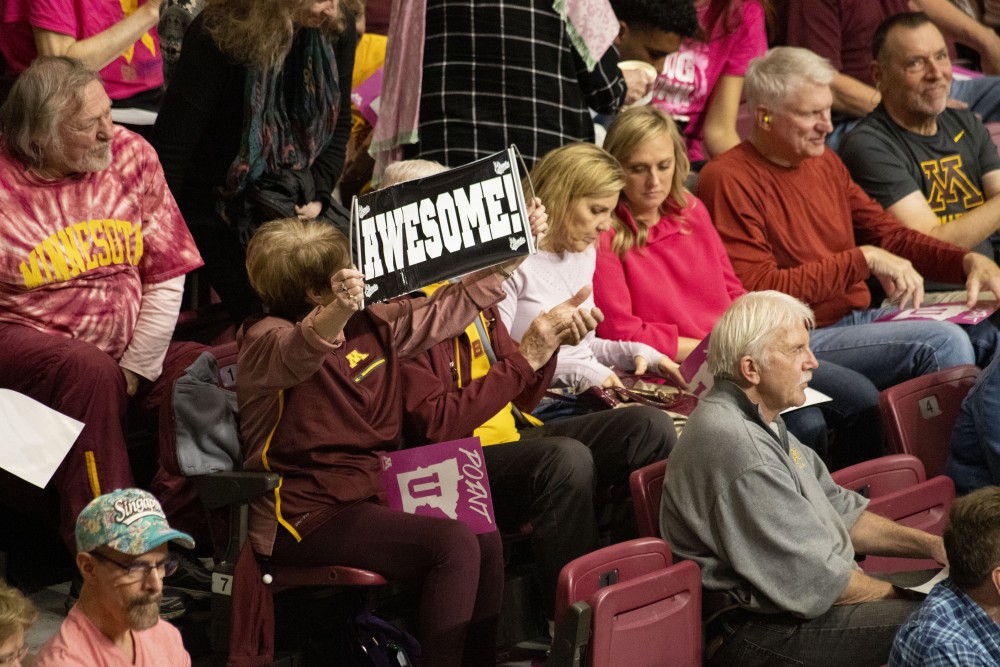 Fans cheer on the Gophers at the Maturi Pavilion on Saturday, Oct. 19. They defeated Illinois three sets to one. 