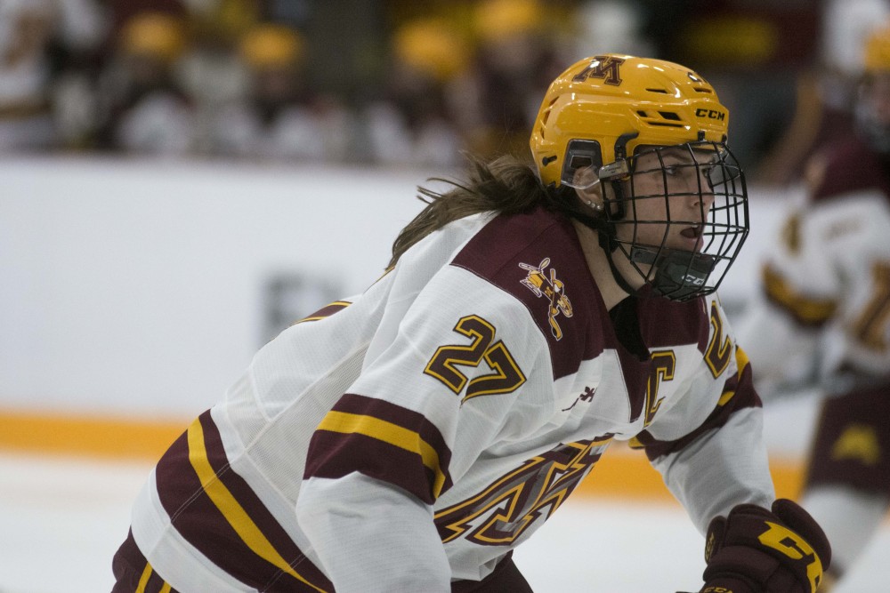 Defender Patti Marshall skates to engage the puck at Ridder Arena on Saturday, Oct. 19. The Gophers defeated St. Cloud State 3-0.