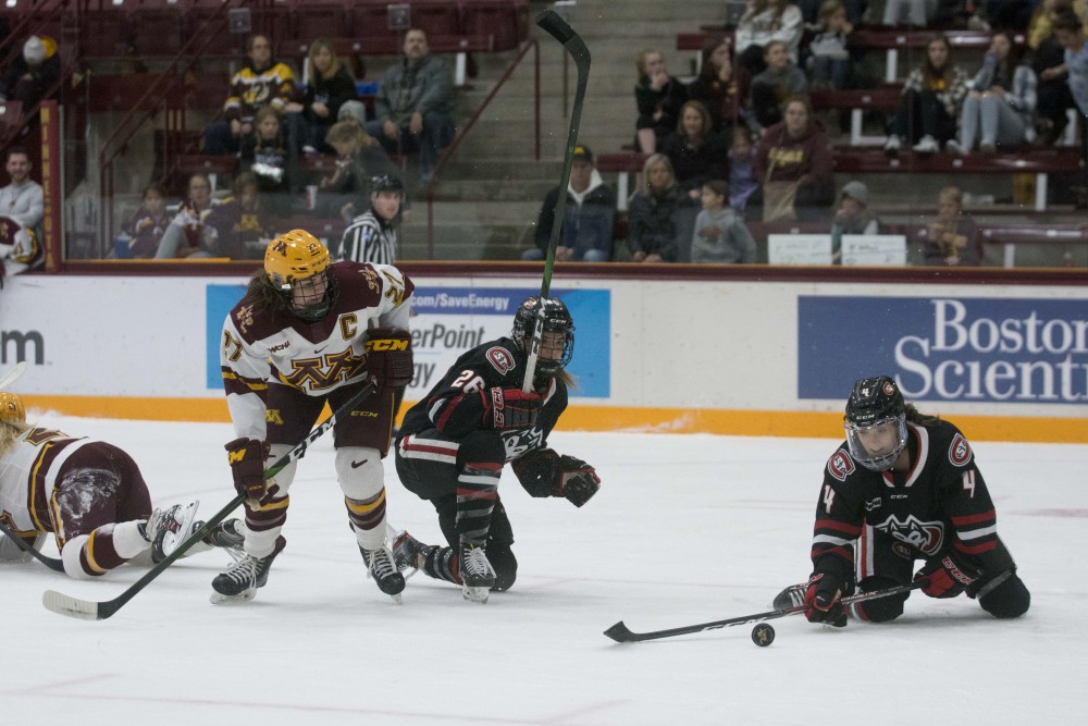 Defender Patti Marshall eyes the puck at Ridder Arena on Saturday, Oct. 19. The Gophers won against St. Cloud State 3-0.