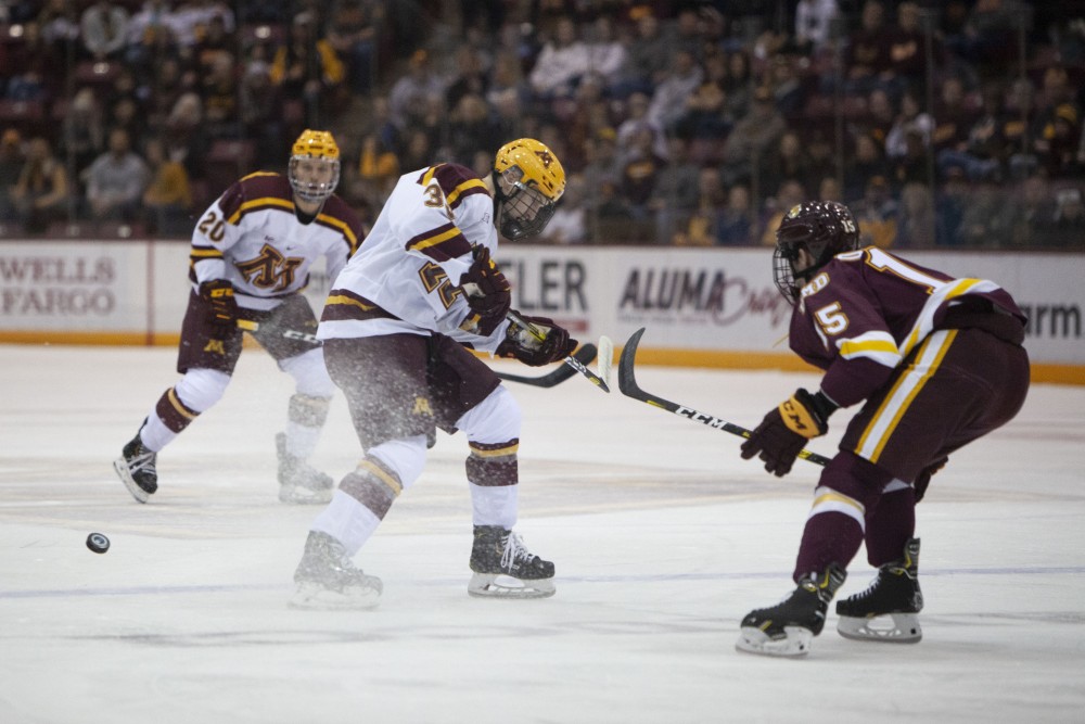 Defenseman Robbie Stucker searches for the puck at the 3M Arena at Mariucci on Friday, Oct. 25. The Gophers went on to lose 2-5 to the University of Minnesota Duluth. 