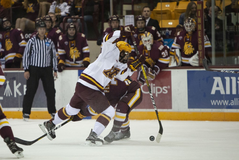 Forward Blake McLaughlin pushes past a defender at the 3M Arena at Mariucci on Friday, Oct. 25. The Gophers went on to lose 2-5 to the University of Minnesota Duluth. 