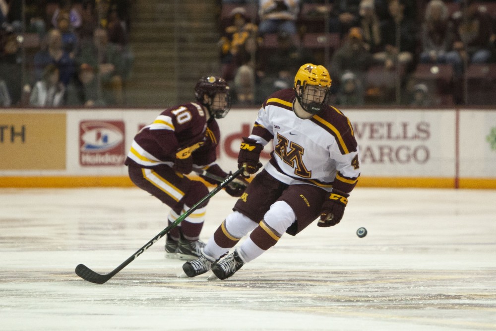 Defenseman Ben Brinkman searches for the puck at the 3M Arena at Mariccui on Friday, Oct. 25. The Gophers went on to lose 2-5 to the University of Minnesota Duluth. 