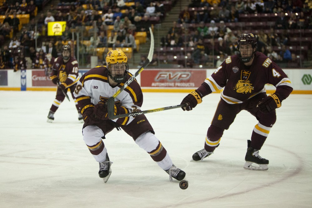 Forward Ben Meyers chases the puck at the 3M Arena at Mariucci on Friday, Oct. 25. The Gophers went on to lose 2-5 to the University of Minnesota Duluth. 