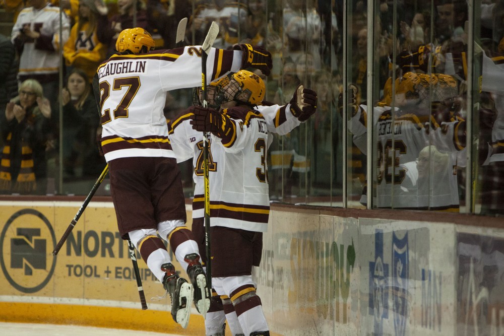 Forward Blake McLaughlin leaps into the air to celebrate a goal at the 3M Arena at Mariucci on Friday, Oct. 25. The Gophers went on to lose 2-5 to the University of Minnesota Duluth. 