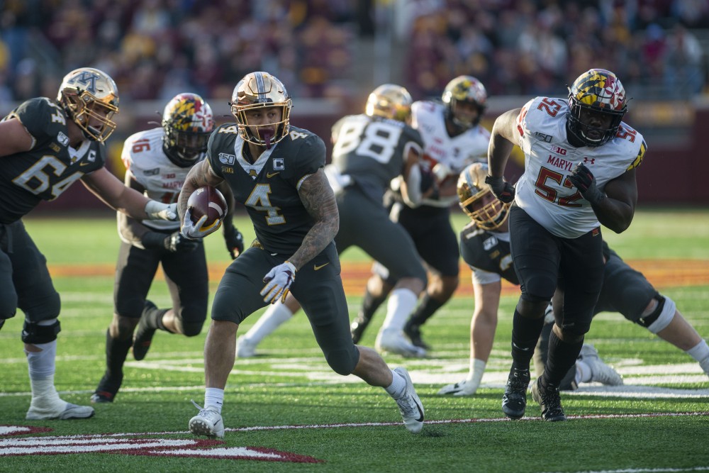 Shannon Brooks carries the ball at TCF Bank Stadium on Saturday, Oct. 26. The Gophers defeated Maryland 52-10 bringing their record to 8-0. 