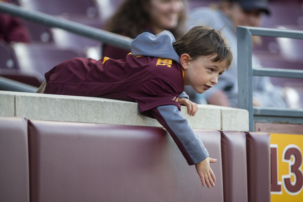 A Gopher fan beats the side of the stands at TCF Bank Stadium on Saturday, Oct. 26.