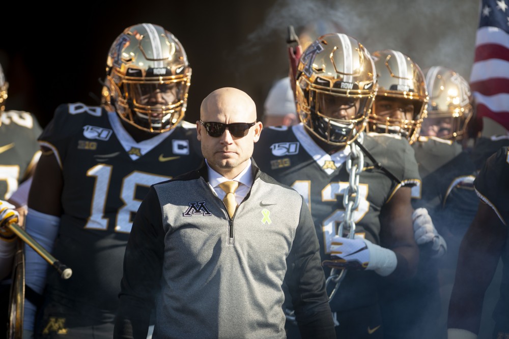 Head Coach P.J. Fleck prepares to run onto the field with the Gophers at TCF Bank Stadium on Saturday, Oct. 26, 2019. The Gophers defeated Maryland 52-10 bringing their record to 8-0
