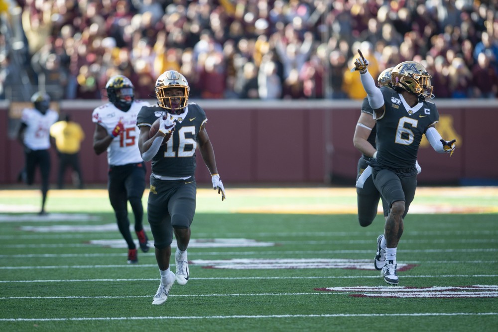 Wide receiver Seth Green carries the ball down the field at TCF Bank Stadium on Saturday, Oct. 26. The Gophers defeated Maryland 52-10 bringing their record to 8-0.