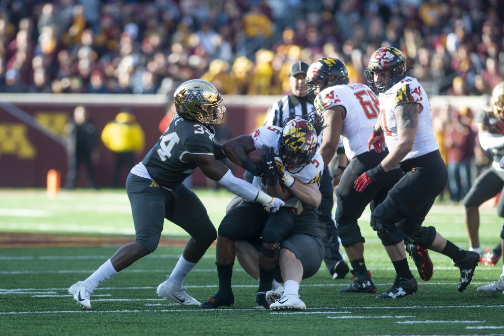 The Gophers bring down the Maryland ball carrier at TCF Bank Stadium on Saturday, Oct. 26. The Gophers defeated Maryland 52-10 bringing their record to 8-0.