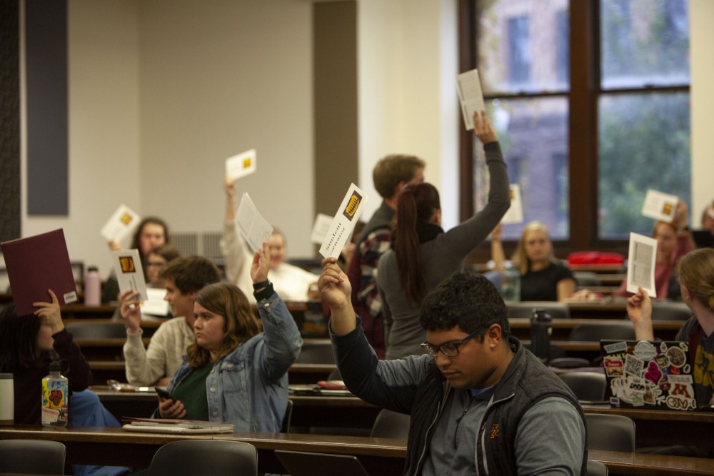 Student senators and representatives vote to move the forum to a closed session in Fraser Hall on Tuesday, Oct. 22. The vote passed, leaving only voting members and press for the remainder of the session. 
