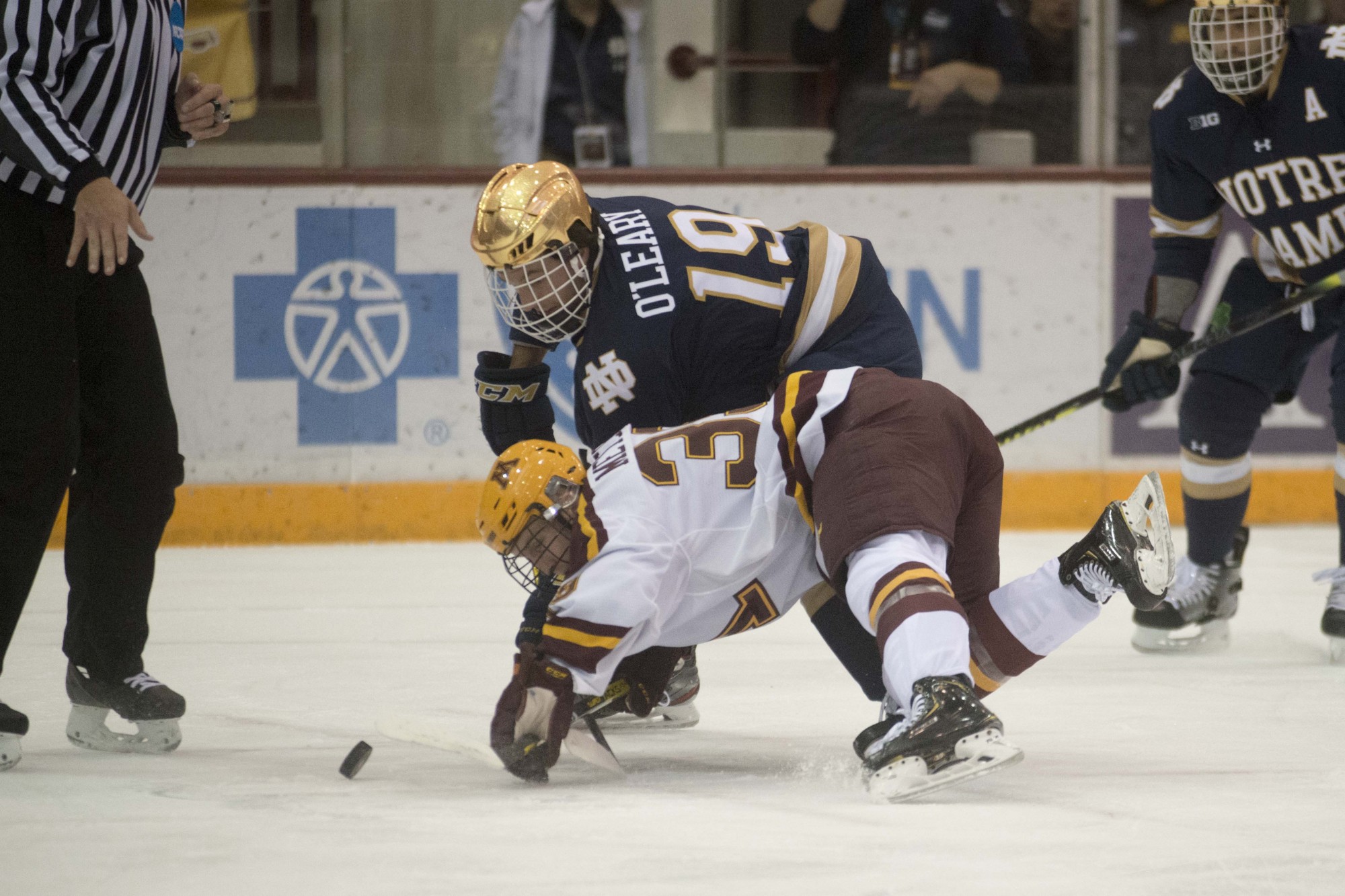 Forward Ben Meyers falls towads the puck during the game against the Notre Dame Fighting Irish at 3M Arena at Mariucci on Friday, Nov. 1. The Gophers won 3-2 in double overtime. 