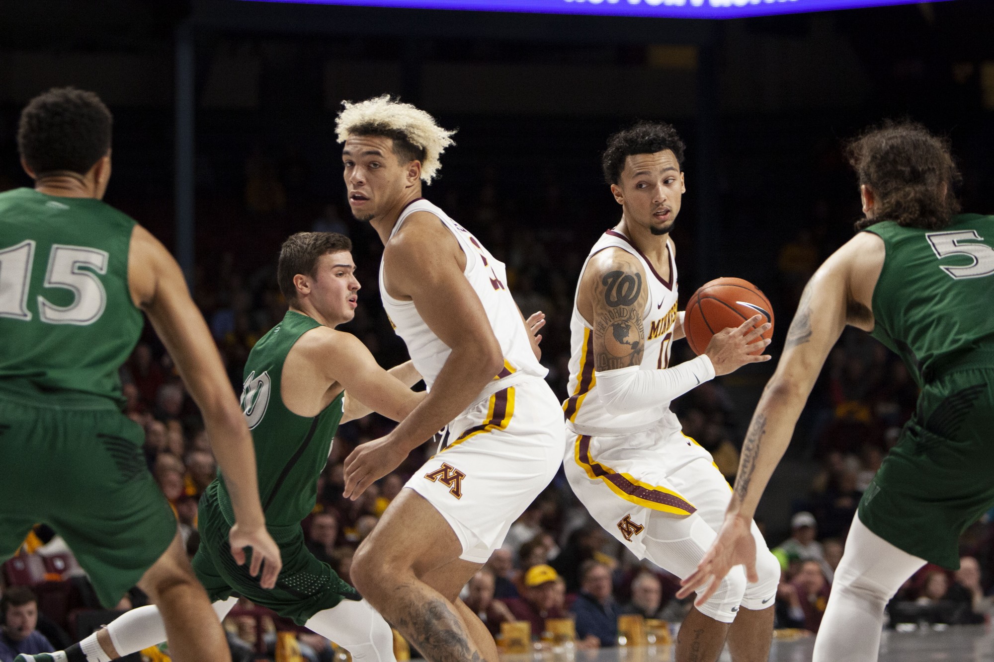 Gophers, from left, Forward Jarvis Omersa and Guard Payton Willis confront defenders at Williams Arena on Tuesday, Nov. 5. The Gophers went on to defeat Cleveland State 85-50. 