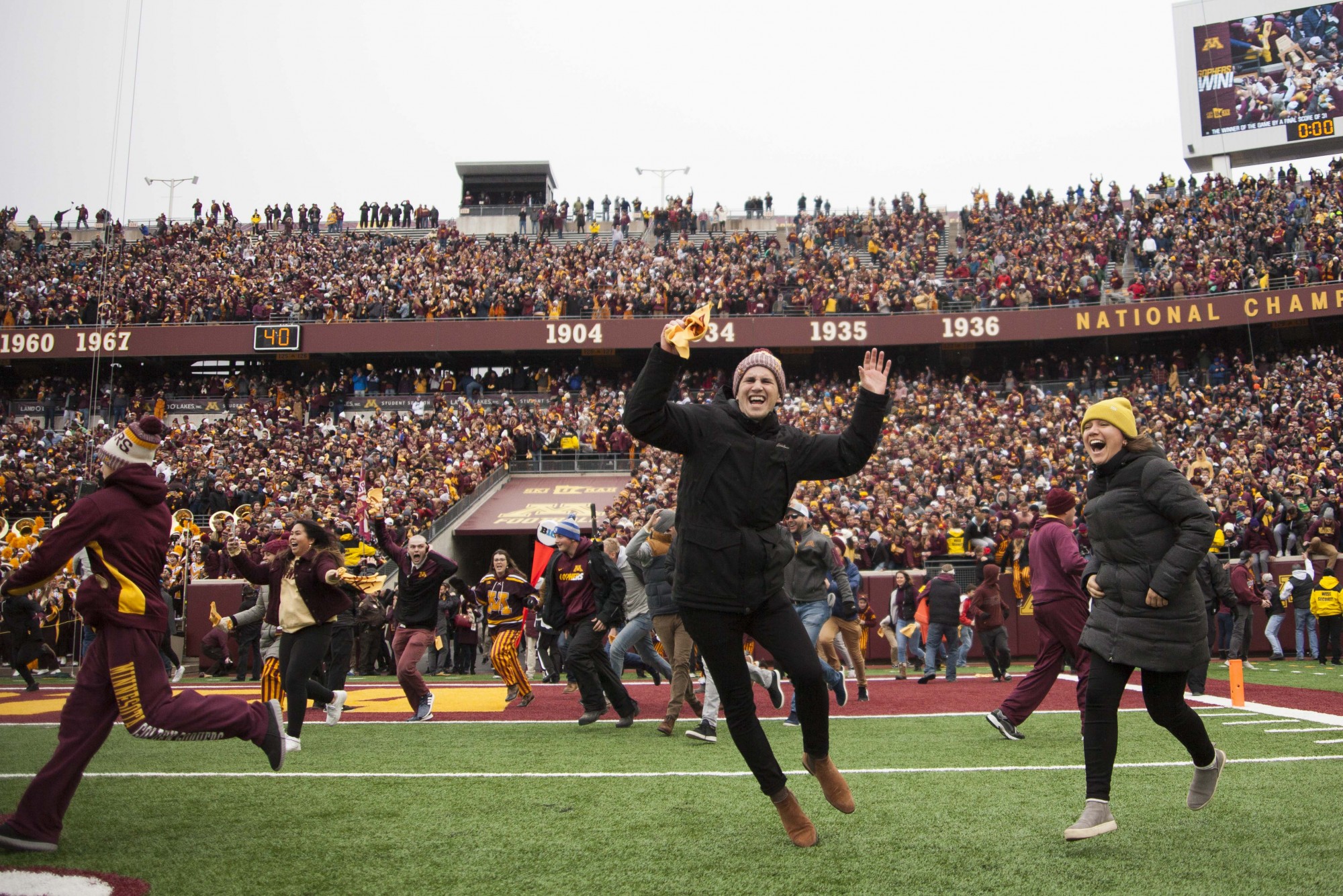 Fans rush the field at TCF Bank Stadium on Saturday, Nov. 9 following the Gophers 31-26 win over Penn State. The win brings their record to 9-0. A first since 1940. 