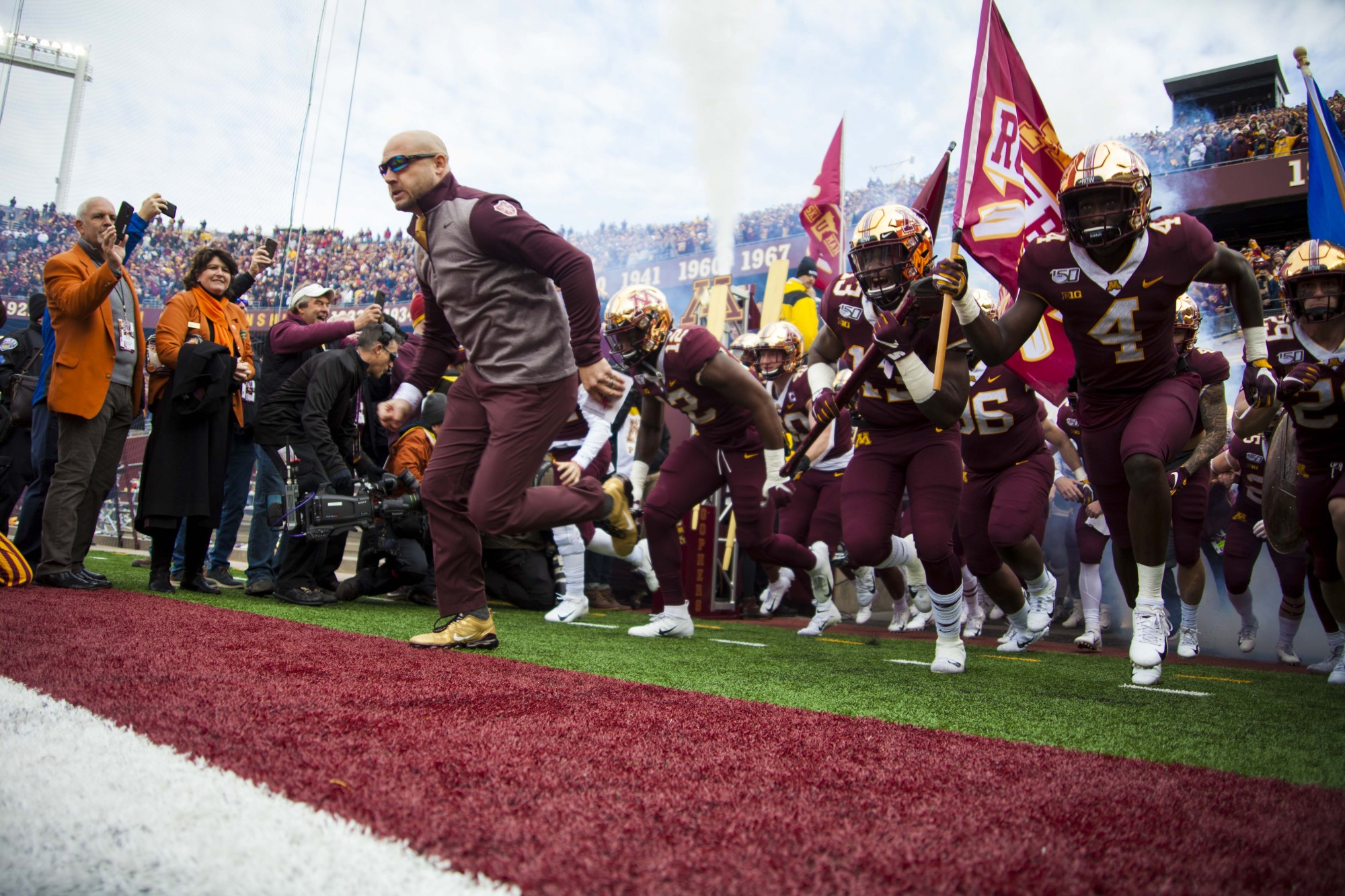 Head Coach PJ Fleck leads the team out of the tunnel at TCF Bank Stadium on Saturday, Nov. 9. The Gophers defeated Penn State 31-26 to bring their record to 9-0. A first since 1904. 