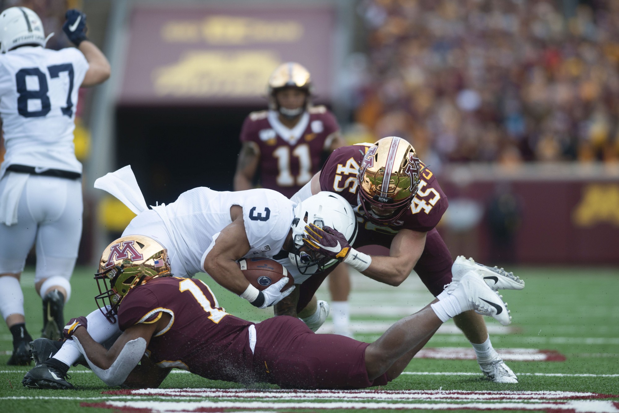 The Gophers bring down the Nittany Lions ball carrier at TCF Bank Stadium on Saturday, Nov. 9. They defeated Penn State 31-26 to bring their record to 9-0. A first since 1904. 