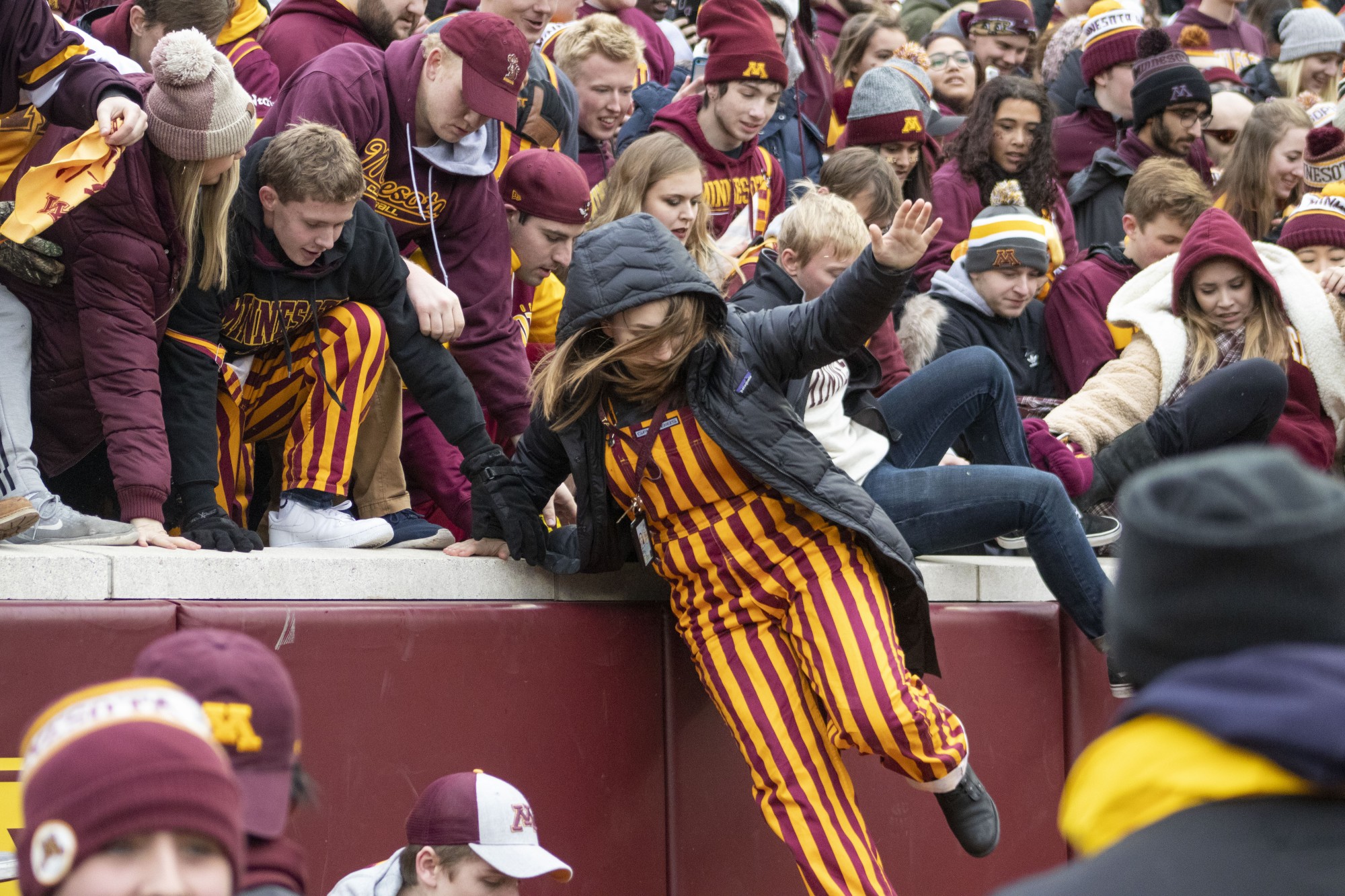Fans storm the field at TCF Bank Stadium on Saturday, Nov. 9. The Gophers defeated Penn State 31-26 to bring their record to 9-0. A first since 1904.