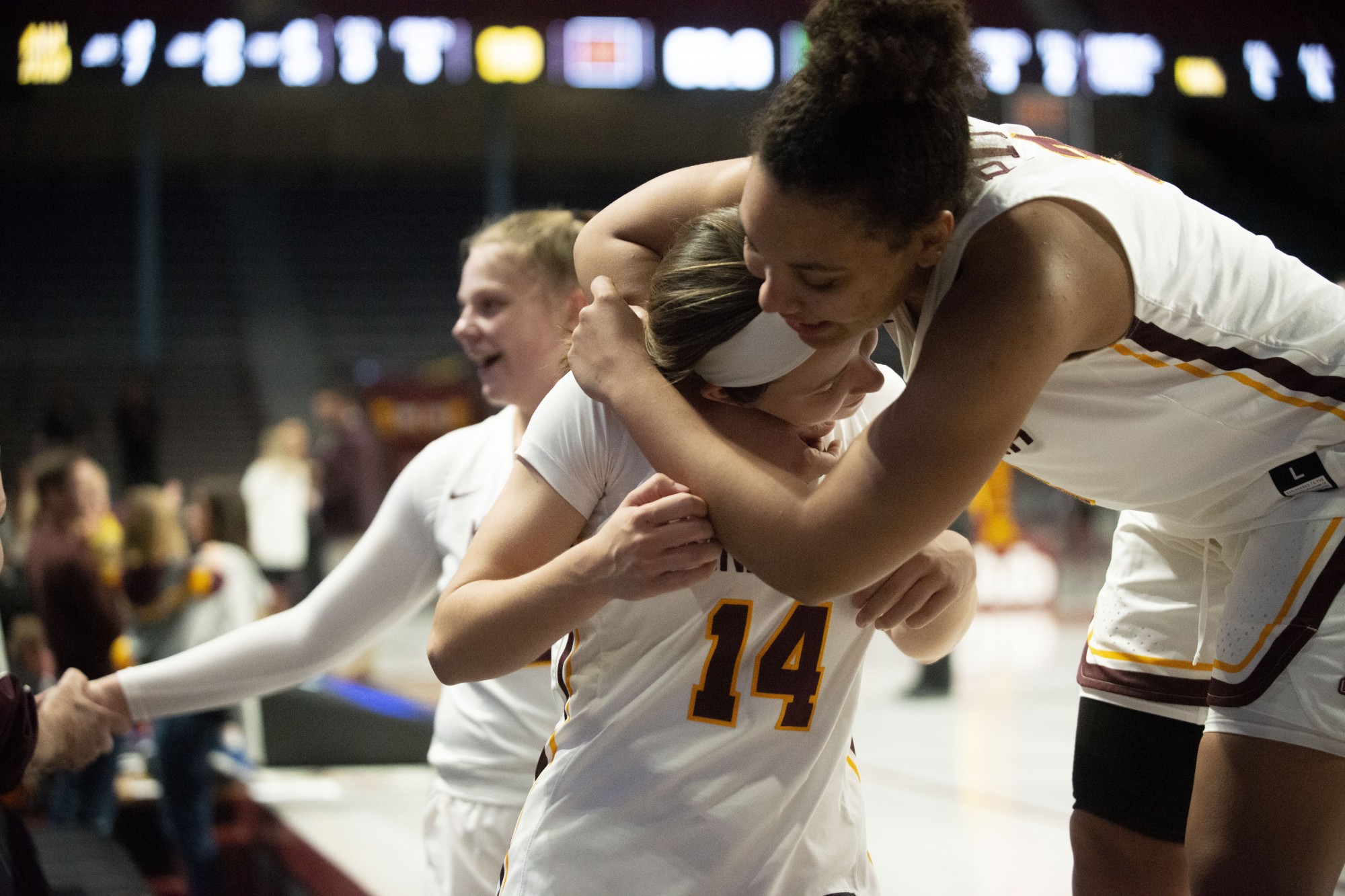 Forward Destiny Pitts hugs Guard Sara Scalia after winning against Vermont at William Arena on Sunday, Nov. 10. 