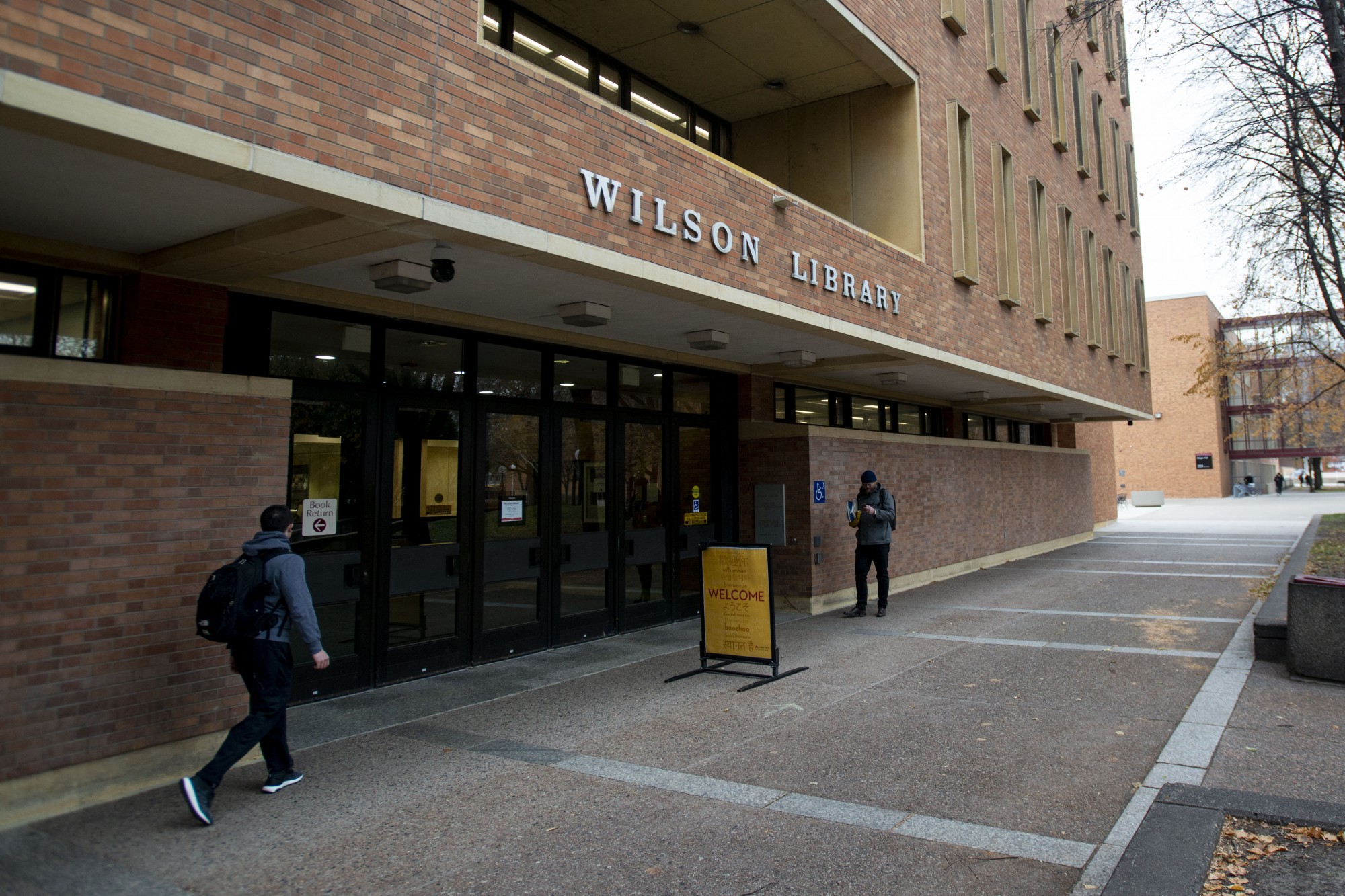 Students walk past Wilson Library on West Bank on Wednesday Nov. 13. 