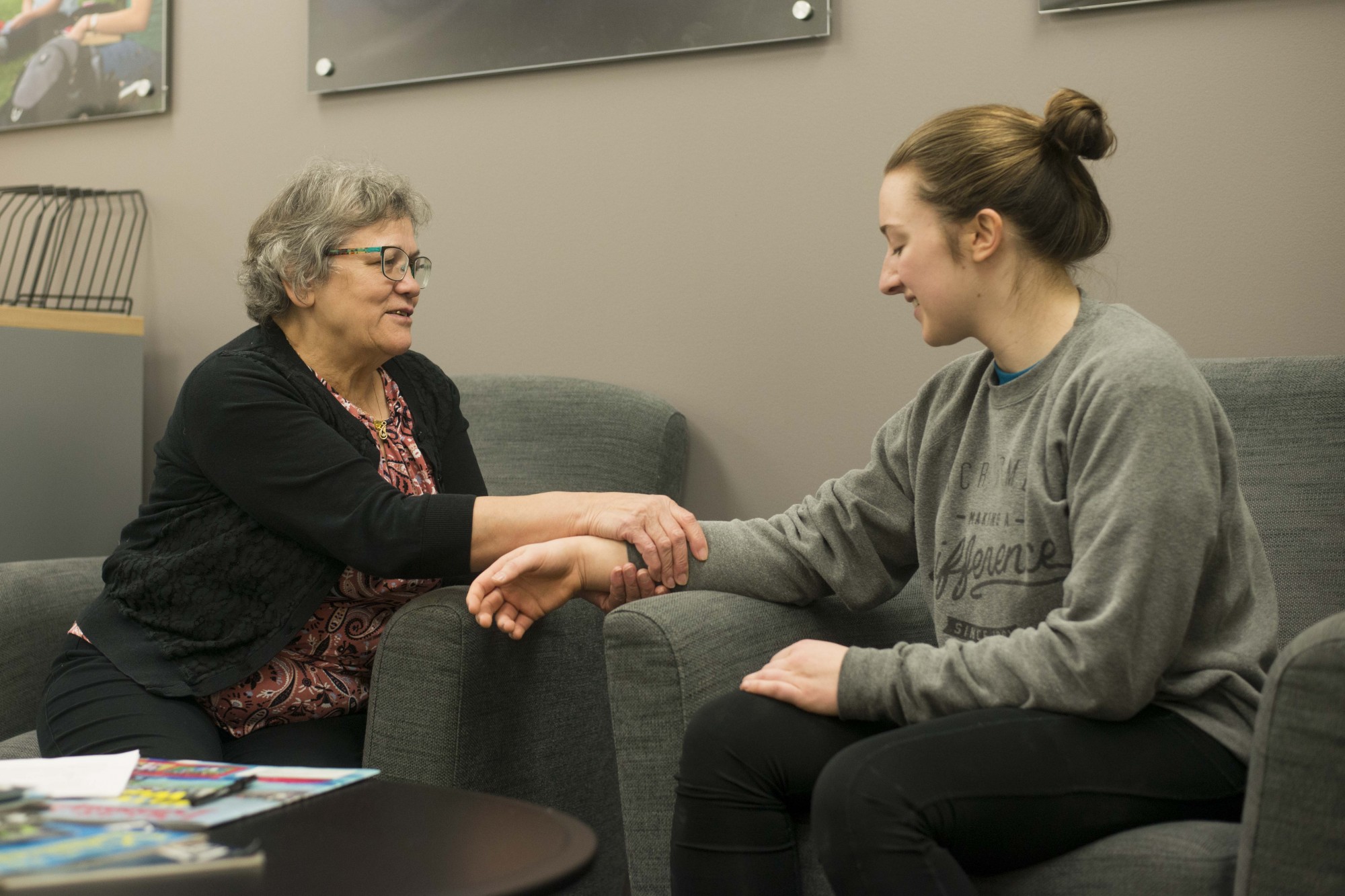 Massage therapist Ioana “Coca” Vladislav gives an impromptu hand massage to student Emily Clarke at the University Recreation and Wellness Center on Monday, Nov. 11. Vladislav is known as “Grandma Coca” and has been working at the U for 20 years.