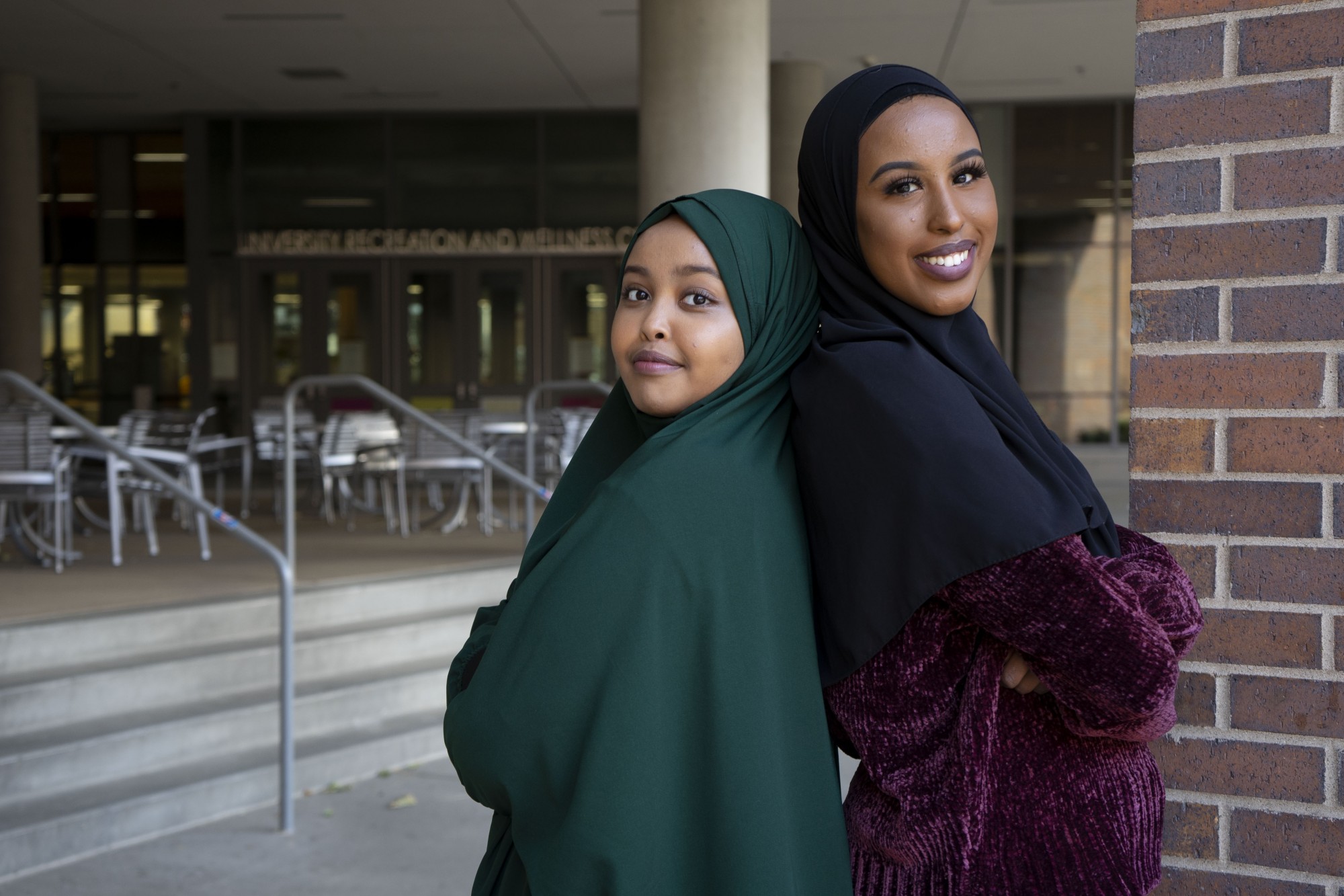 Sumaya Noor, left, and Fahima Osman, right, pose for a portrait outside of the University Recreation and Wellness Center on Saturday, Nov. 16. Noor and Osman initiated a women’s only fitness project after their project discovered many Somali women do not exercise due to a lack of available spaces. 