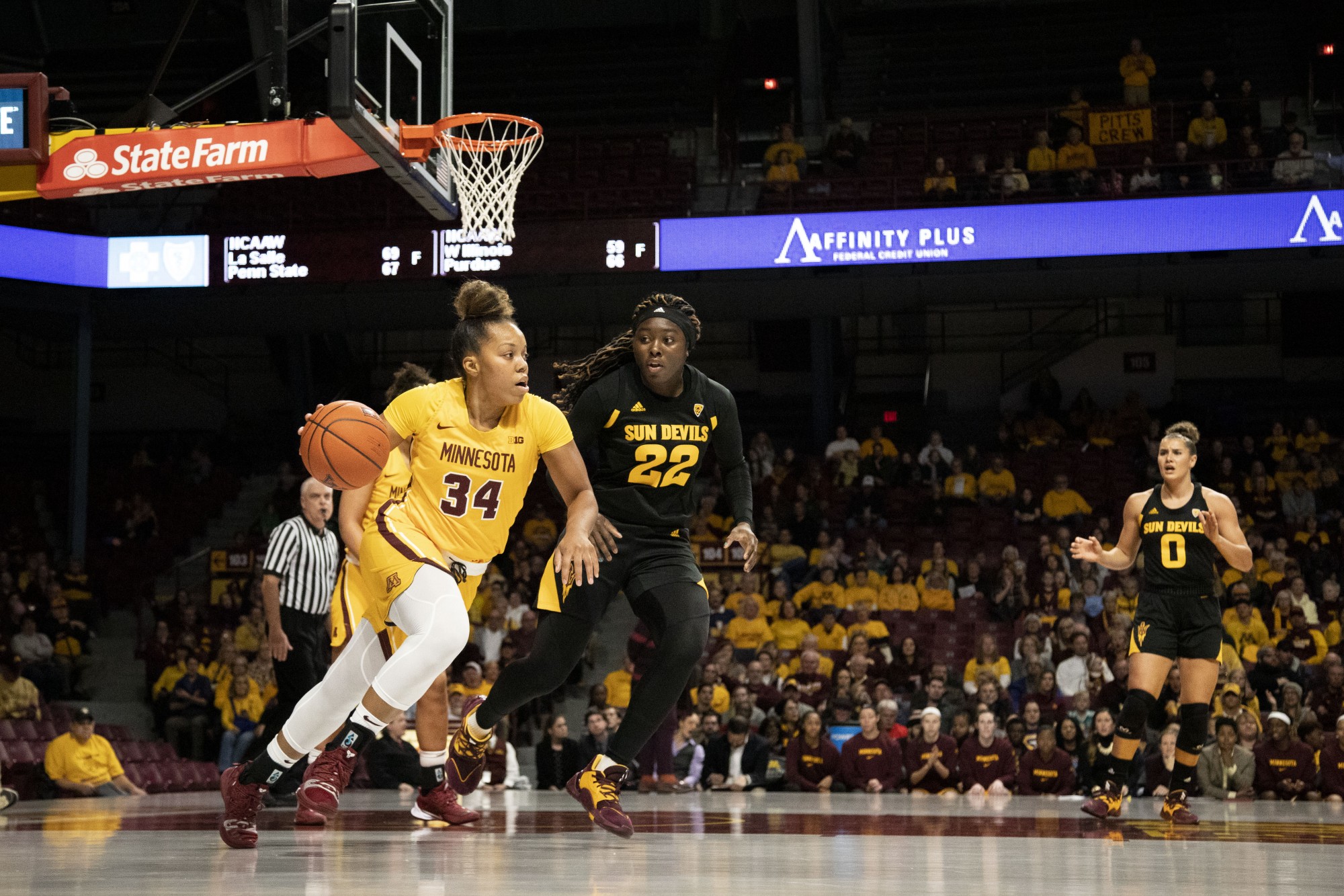 Gadiva Hubbard dribbles around the defender during the game against Arizona State at Williams Arena on Sunday, Nov. 17. The Gophers defeated the Sun Devils 80-66. 