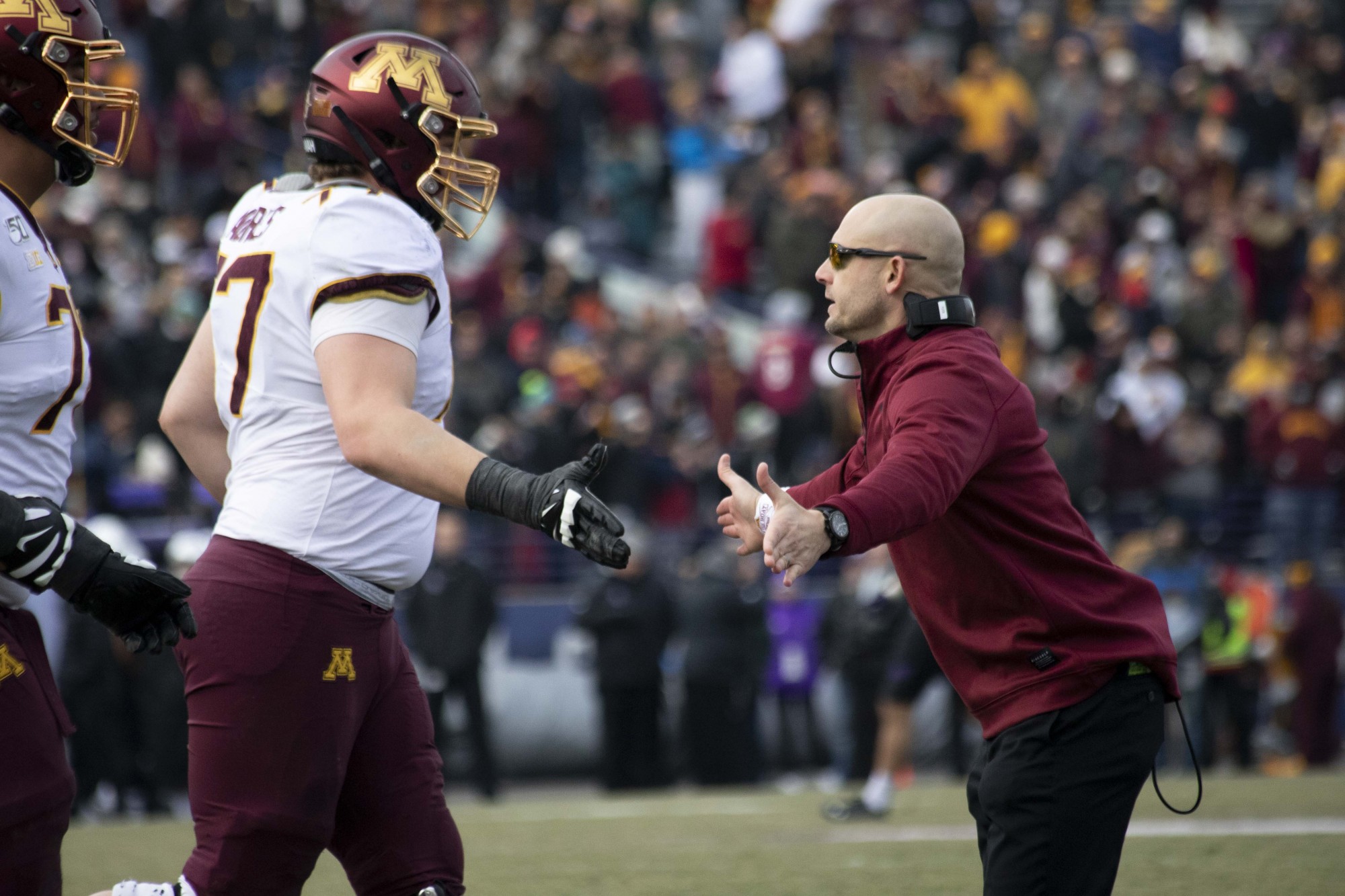 Head coach P.J. Fleck high fives the players as they return to the sidelines at Ryan Field during the game against the Northwestern Wildcats on Saturday, Nov. 23. The Gophers earned a 38-22 victory bringing their record to 10-1. 