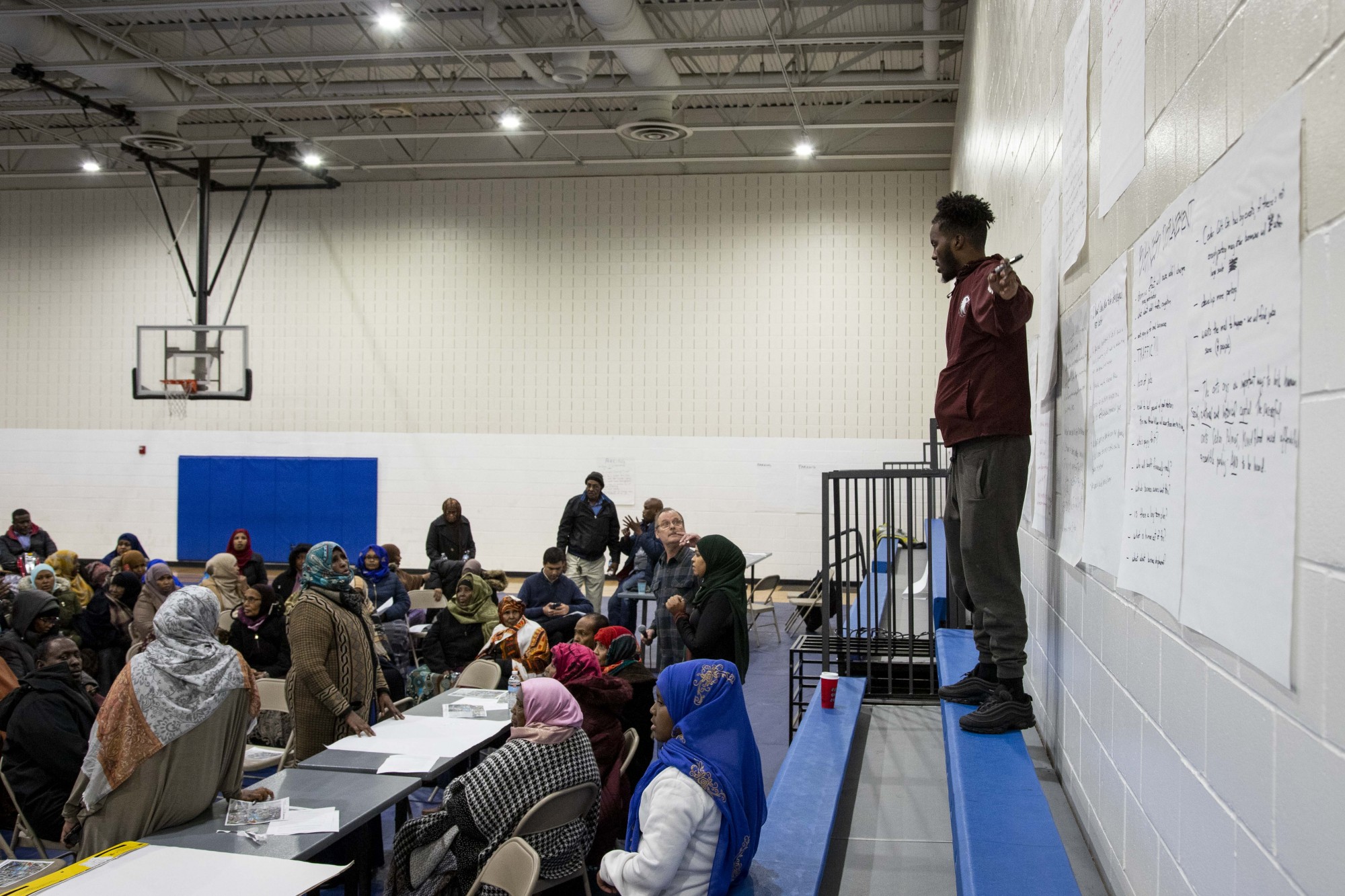 Mohamed Salad, a student at Augsburg University who sits on the board of the Neighborhood Revitalization Program, hosts a listening session regarding the city’s Africa Village public marketplace on Thursday, Nov. 21. 