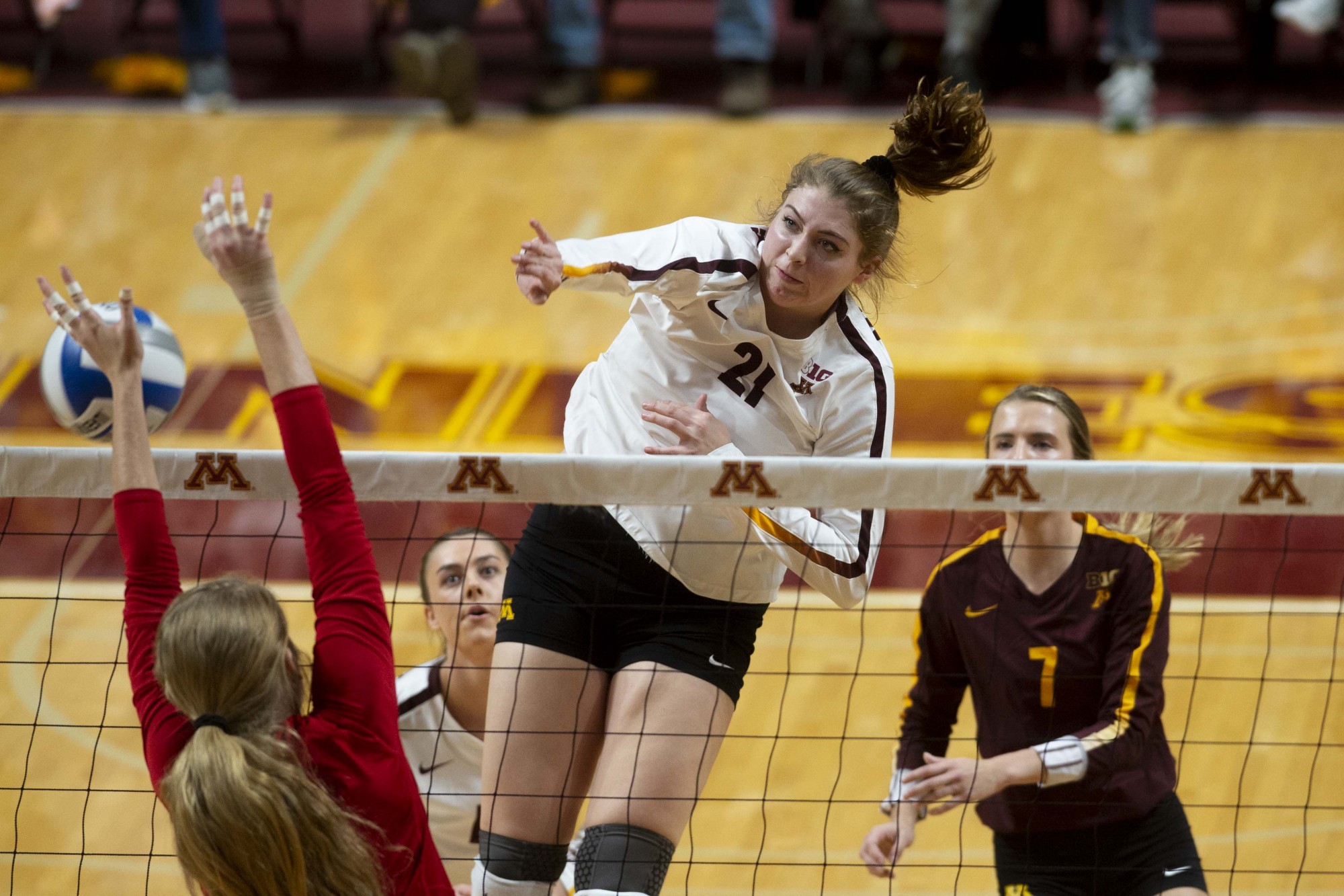 Middle Blocker Regan Pittman jumps to spike the ball at the Maturi Pavilion on Friday, Nov. 22. The Gophers took Nebraska to five sets but ultimately fell 3-2. 