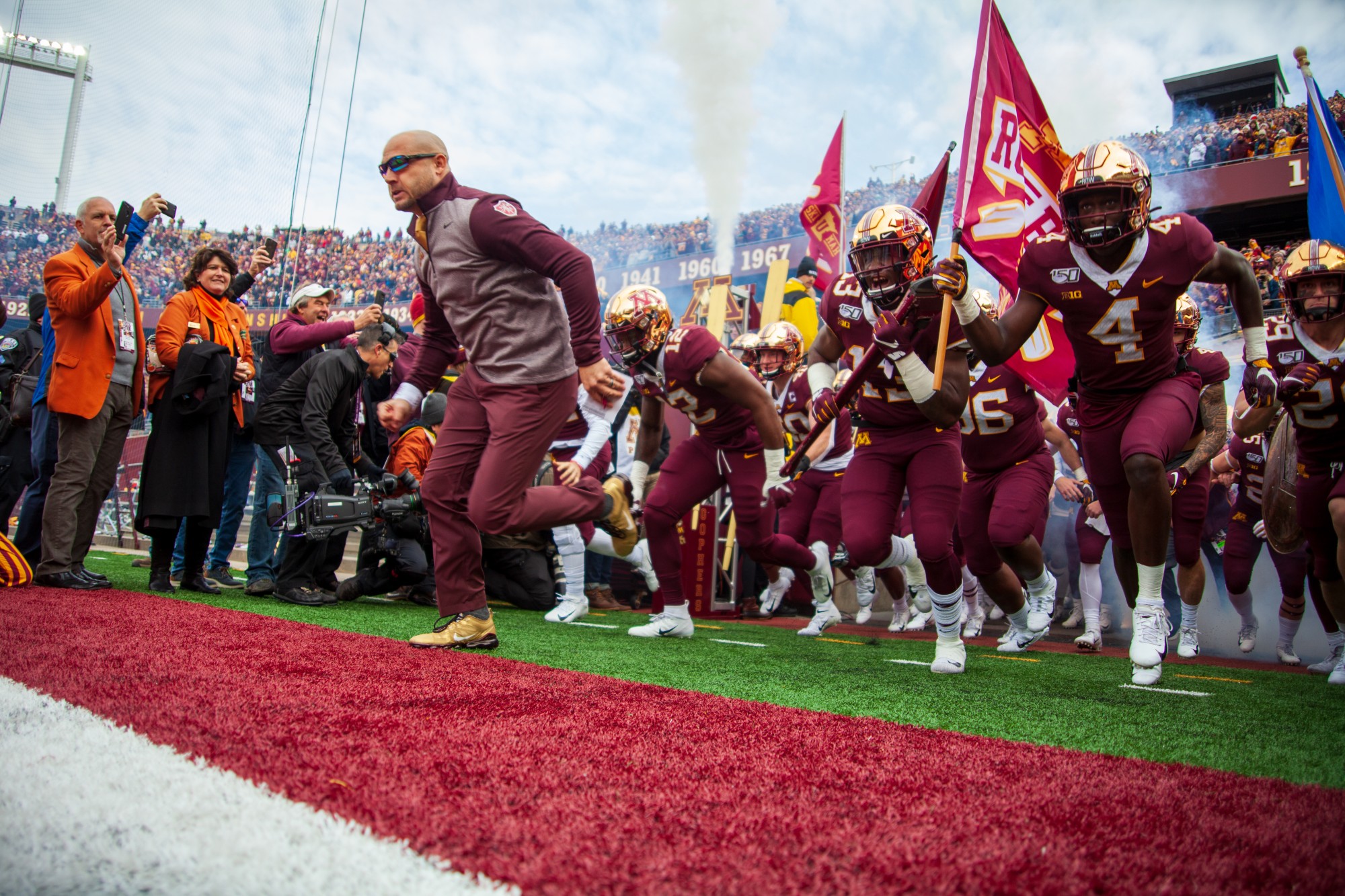 Head Coach PJ Fleck leads the team out of the tunnel at TCF Bank Stadium on Saturday, Nov. 9. The Gophers defeated Penn State 31-26 to bring their record to 9-0. A first since 1904. 