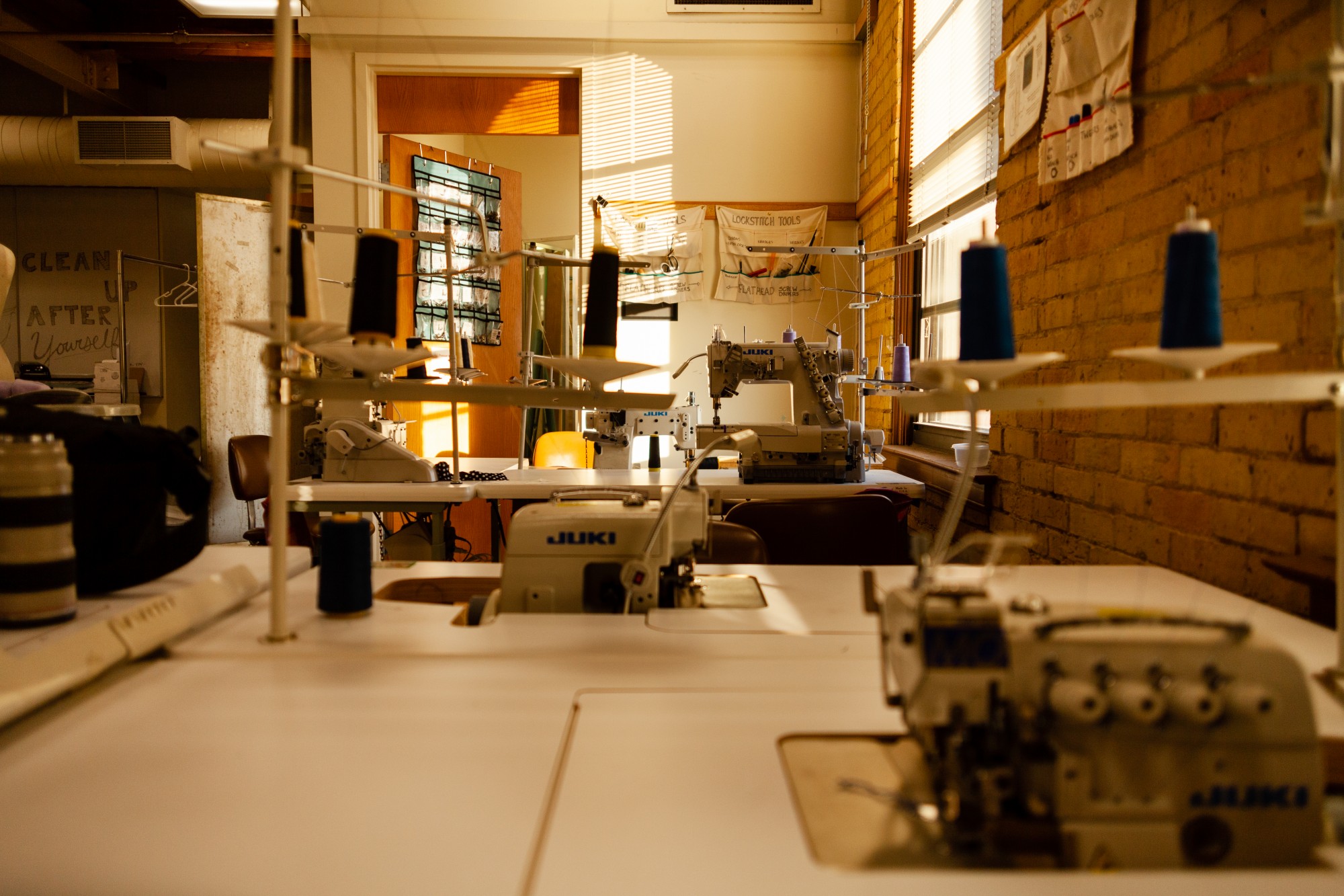 Sewing machines and apparel production tools fill a production room where Britt often works in McNeal Hall. 