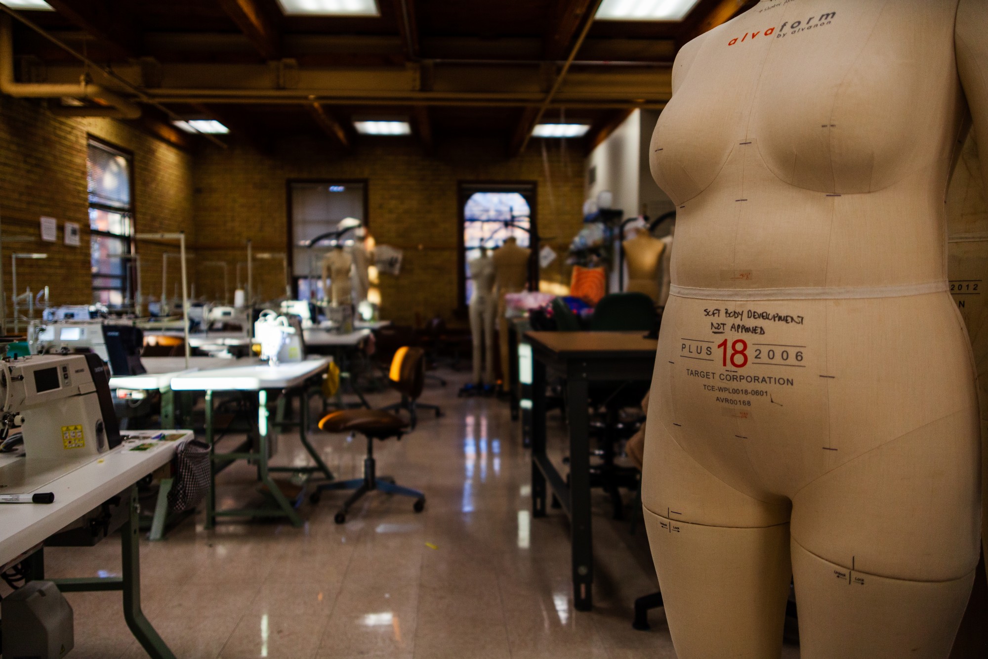 Mannequins, clothing presses and sewing equipment fill a production room in McNeal Hall. Access to equipment such as this enables students in the Apparel Design program to gain experience that will serve them in their careers. 