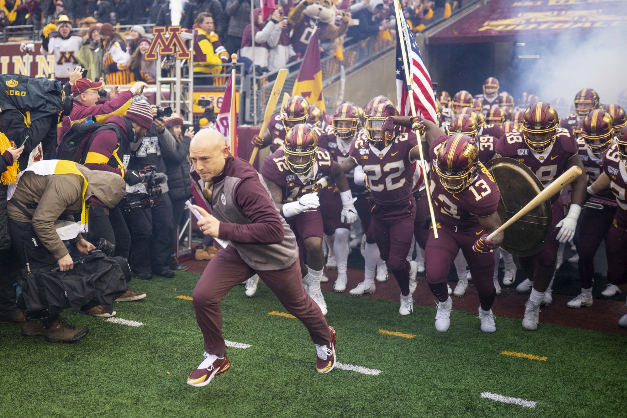 Head Coach P.J. Fleck runs onto the field before the start of the game at TCF Bank Stadium on Saturday, Nov. 30. 