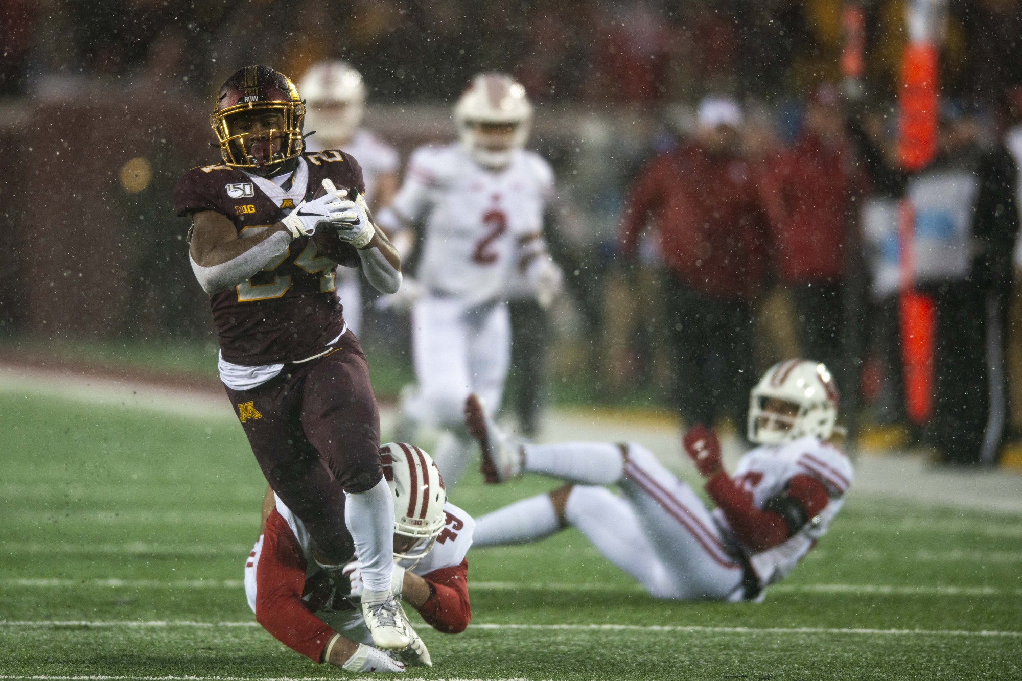 Running back Mohamed Ibrahim runs the ball during the Gopher game against the Badgers at TCF Bank Stadium on Saturday, Nov. 30. 