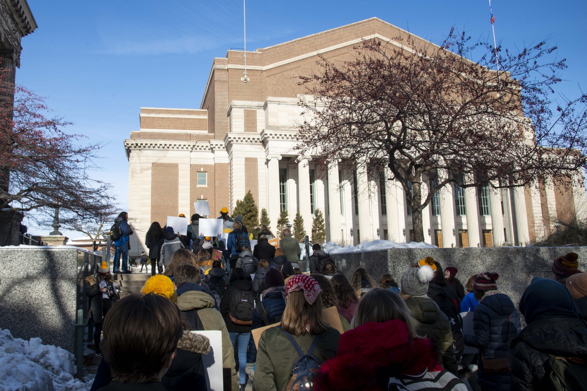 Students and faculty march towards Morrill Hall as part of the UMN Climate Strike on Friday, Dec. 6. Those in attendance criticized the University’s policies on fossil fuel usage.