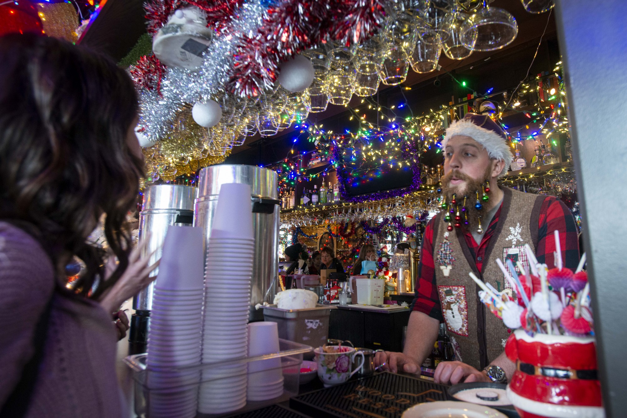 A bartender serves customers at Betty Danger’s Country Club in Northeast Minneapolis on Saturday, Dec. 7. The club held its fourth annual Betty’s Bizarre Bazaar which is an event for local artists to sell their art and homemade food supplies. 